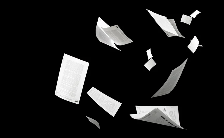 Many flying business documents isolated on black background Papers flying in air in business concept - stock photo